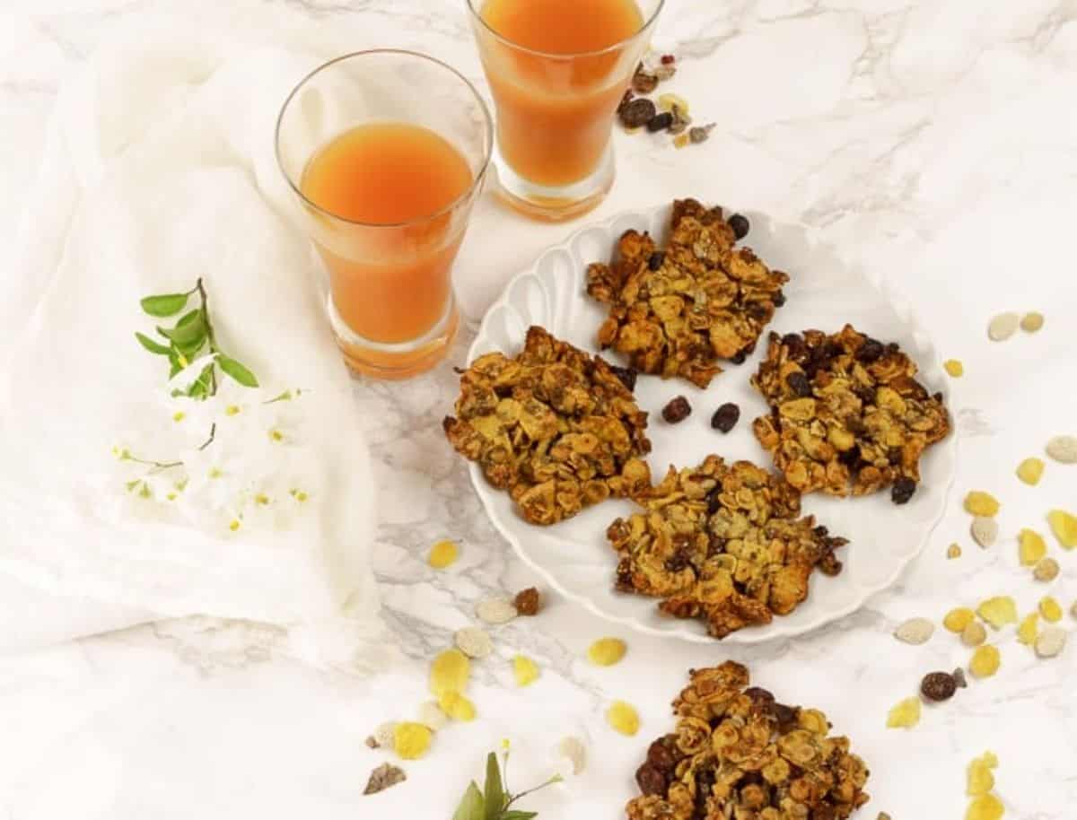 Crispy Crunchy Healthy Muesli Cookies muesli cookies on a plate and orange juice
