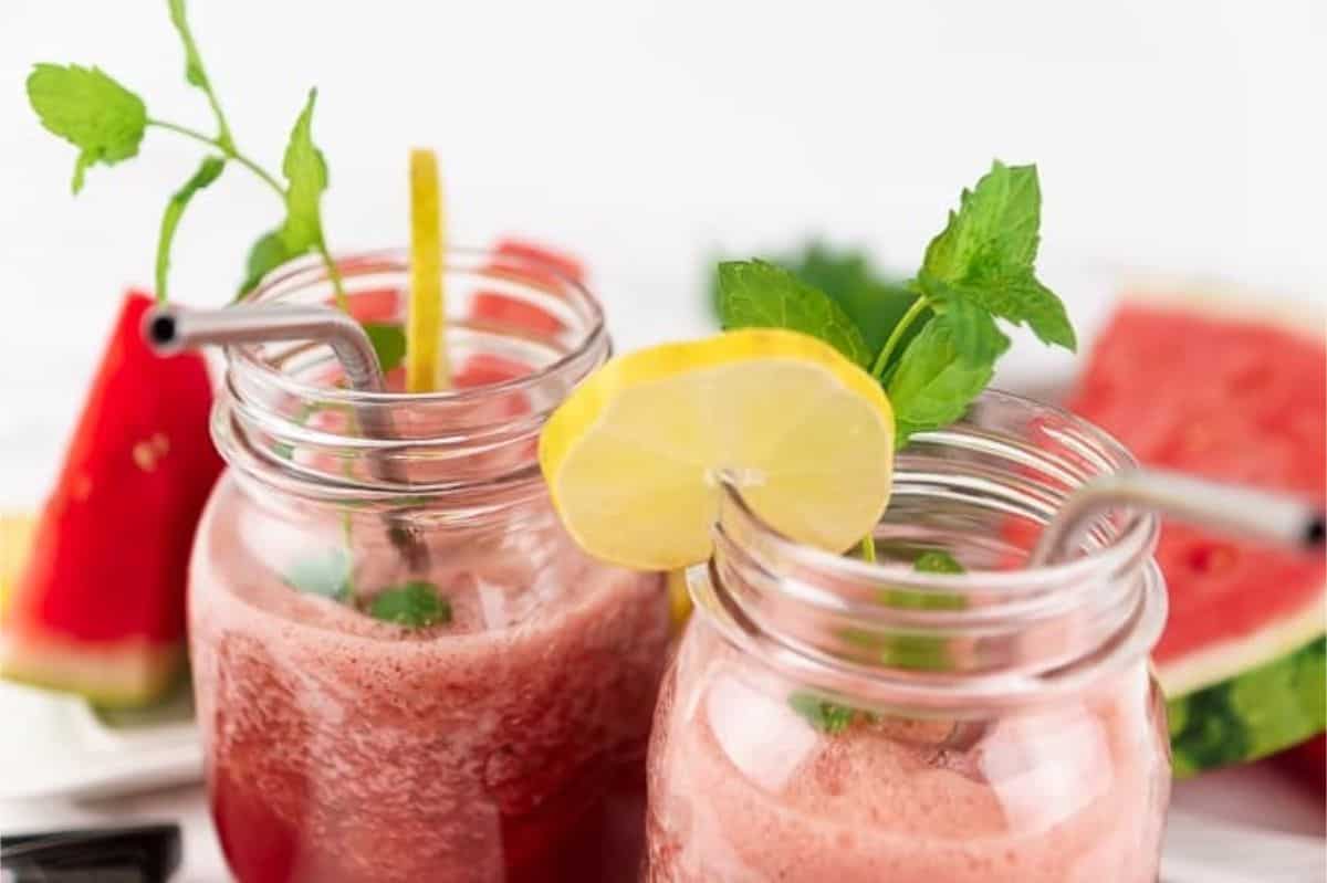 Watermelon Smoothie with Peppermint and Lime close-up of watermelon smoothie in jars