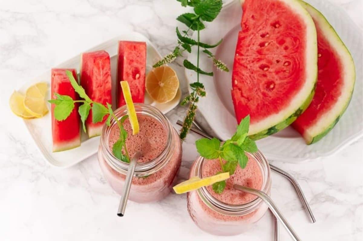 Watermelon Smoothie with Peppermint and Lime watermelon slices and jars with watermelon smoothie