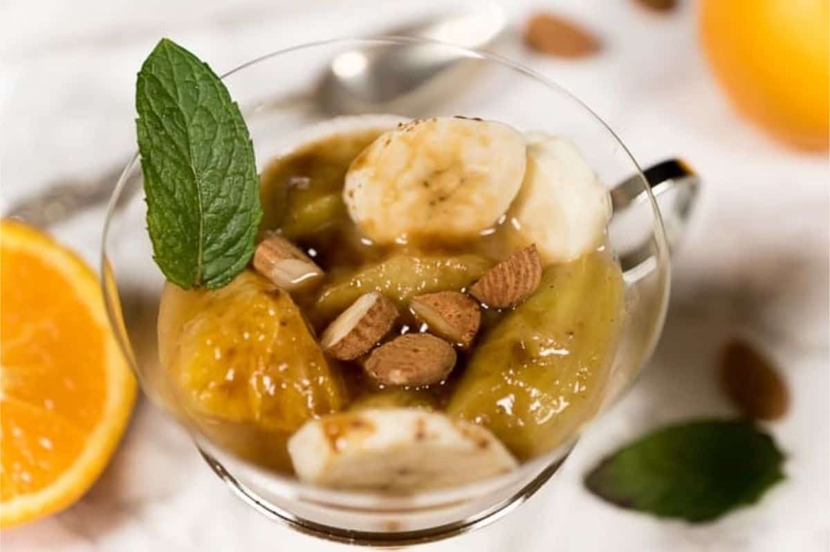 stewed rhubarb with bananas, almonds, oranges, and mint leaves
