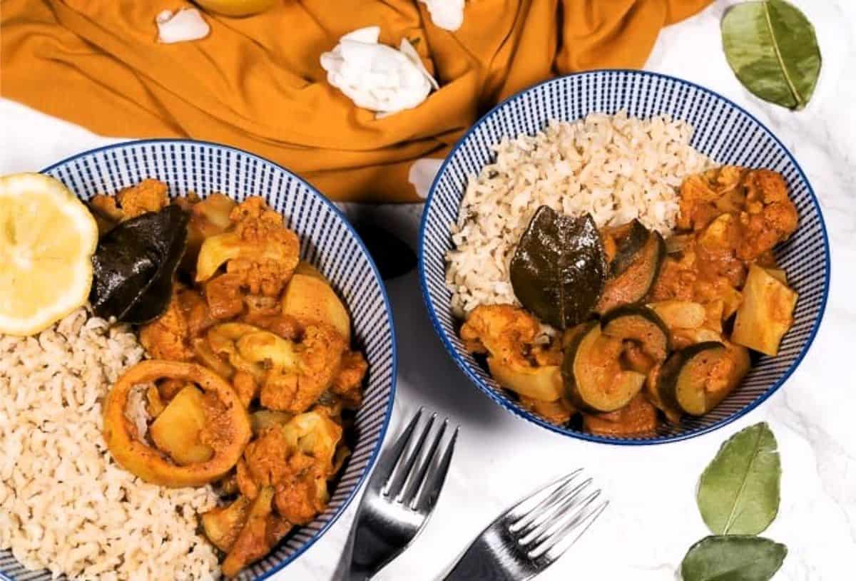 two bowls of lemony cauliflower and potato curry
