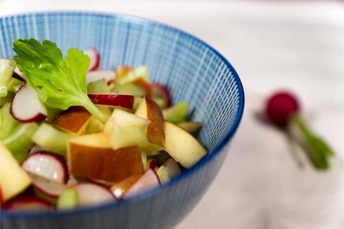 Crisp and refreshing apple radish celery salad crunchy apple & celery salad in a blue bowl
