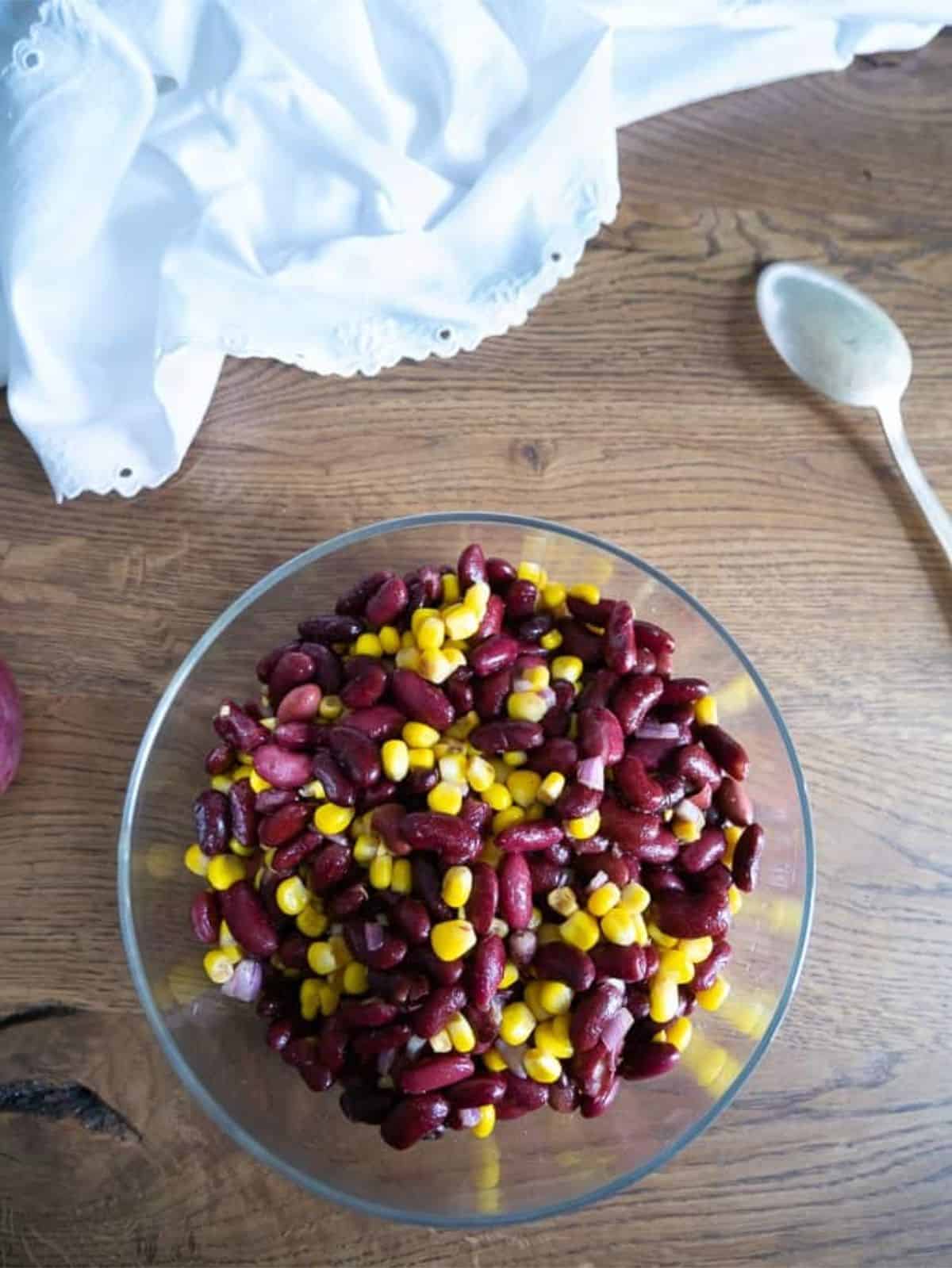 glass bowl with corn kidney bean salad