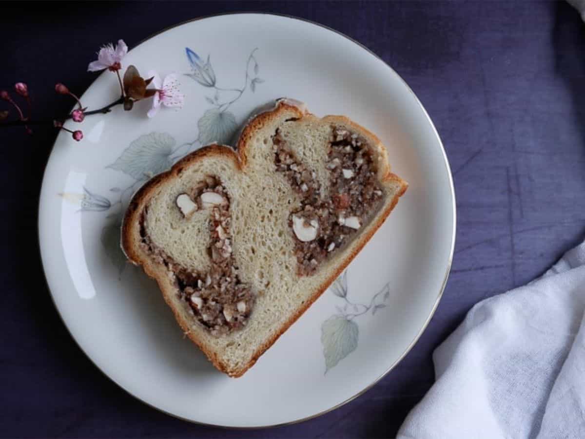 slice of a vegan babka with nuts