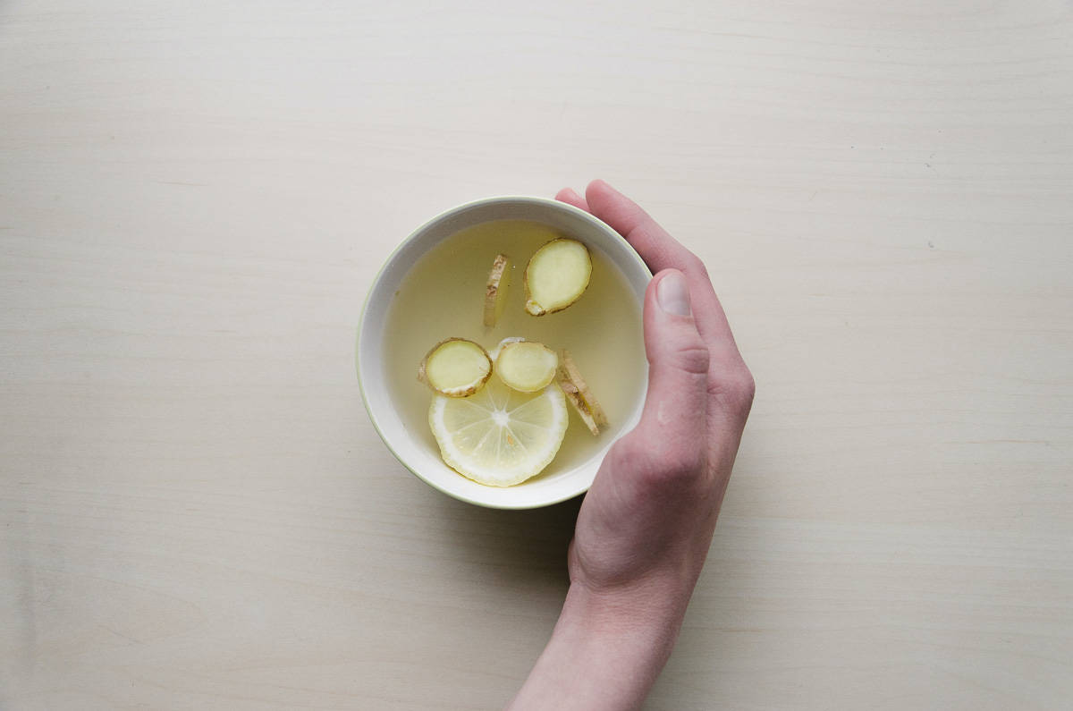A cup of ginger tea with lemon