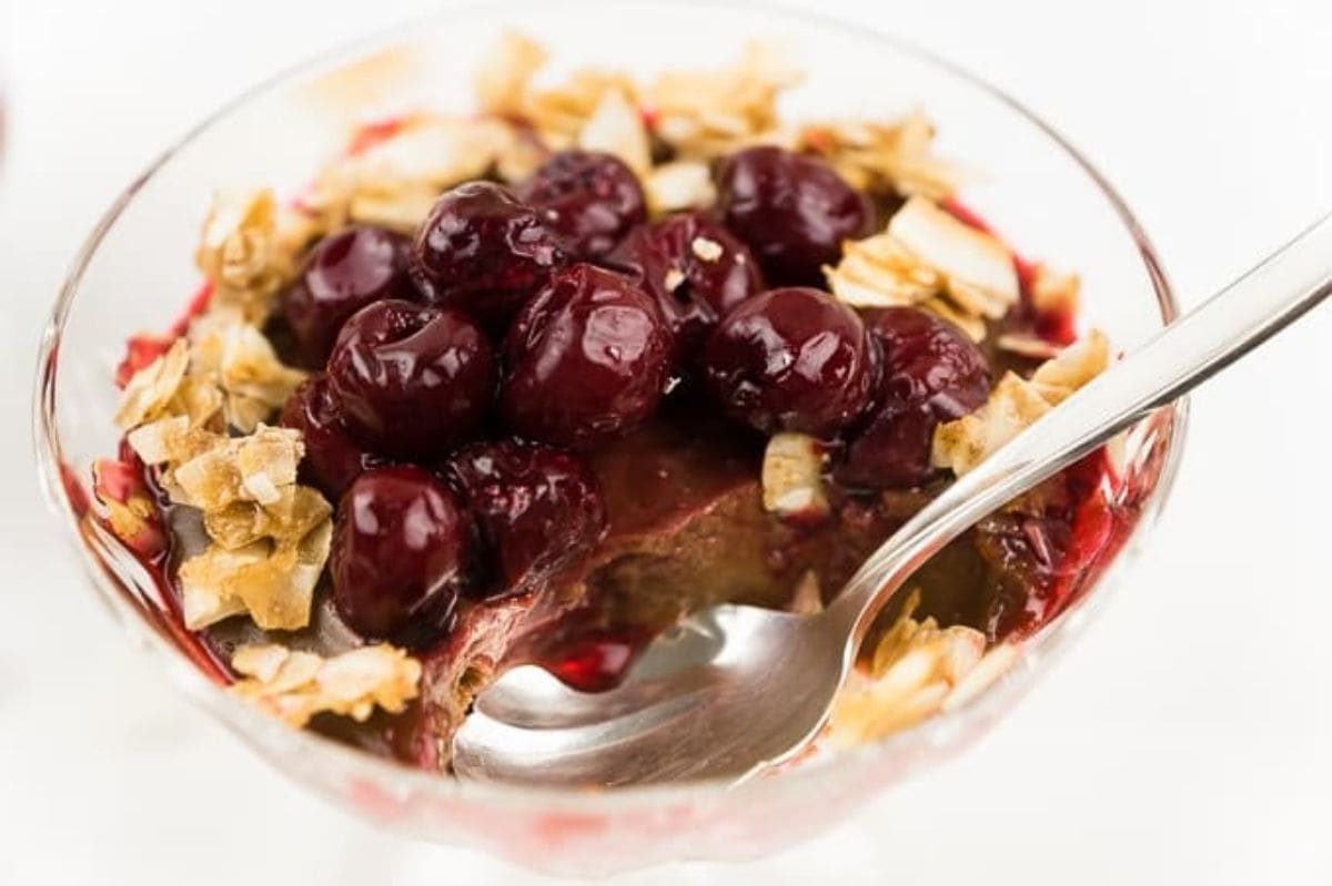 Creamy Coconut Chocolate Pudding with Sour Cherries and Coconut Brittle chocolate coconut pudding topped with sour cherries and coconut chips